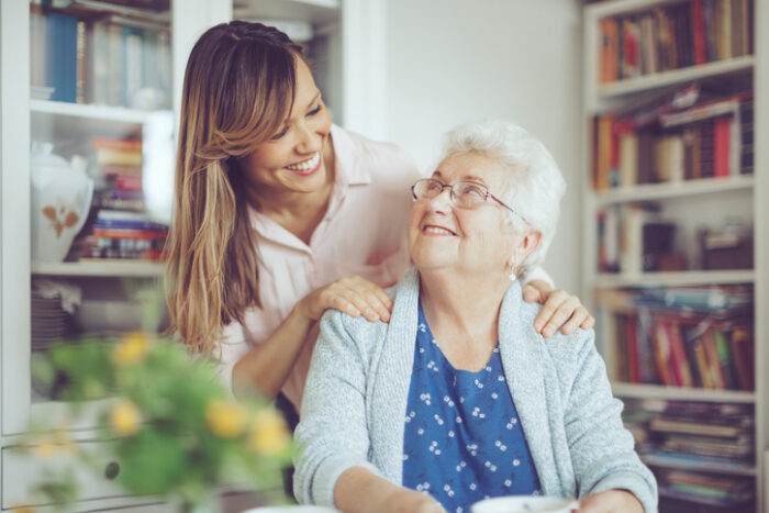 senior living caregiver with resident