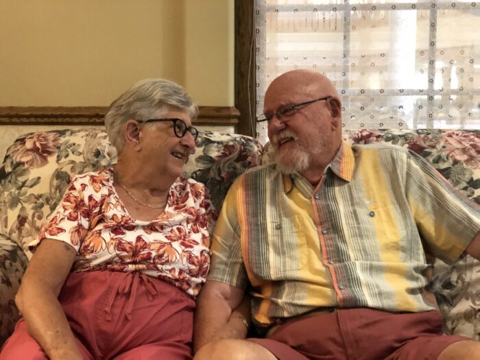 senior living couple smiling at each other
