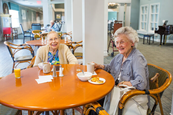 senior living residents having breakfast together