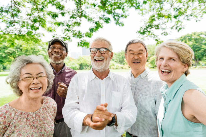 group of seniors outside smiling