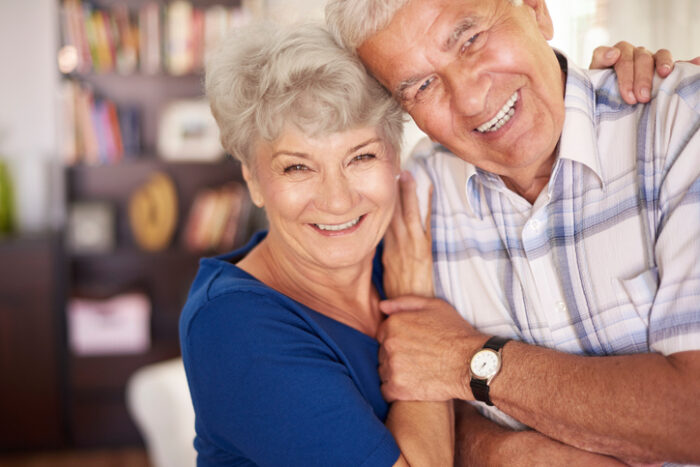 senior couple smiling for a photo