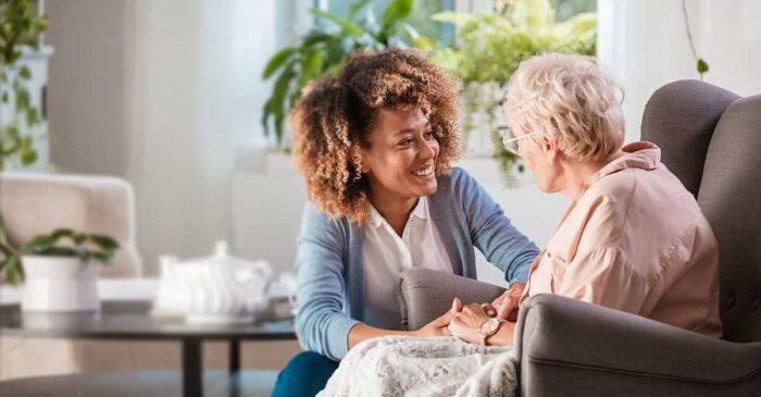 caregiver with a senior sitting relaxing