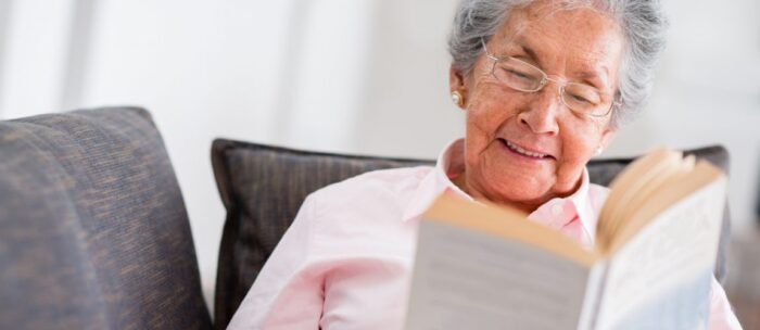 senior living resident reading a book
