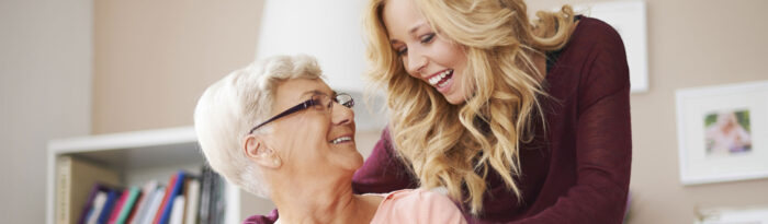 mother and daughter smiling at each other