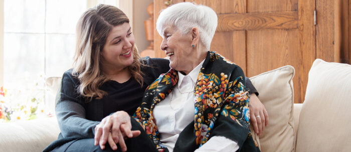 adult daughter talking to her senior mother about transitioning to senior living