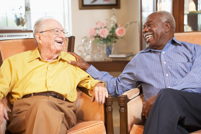 senior living residents talking in the community lobby