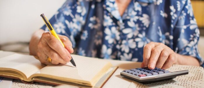 Woman calculating senior living costs