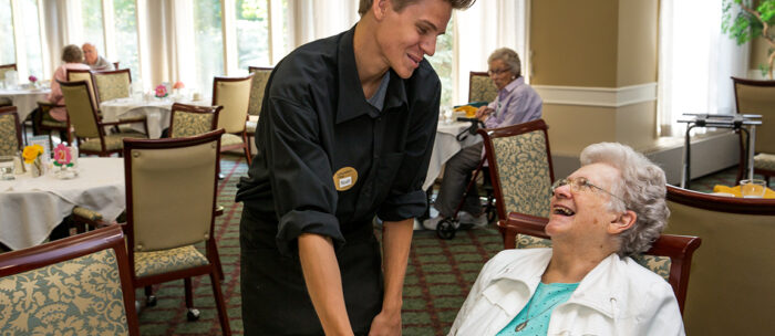 StoryPoint waiter serving a resident