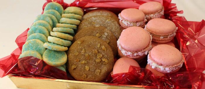 a mix of homemade desserts sitting on a platter at a independence village community for all to share