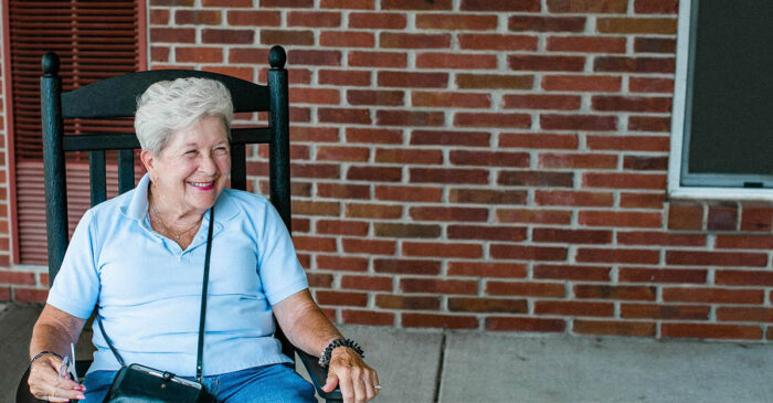 senior living resident relaxing in rocking chair