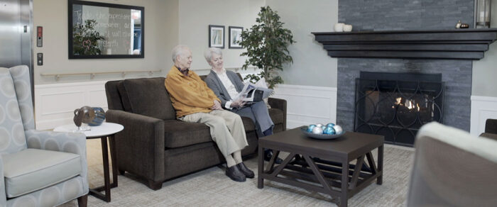 Independent living residents reading in common area