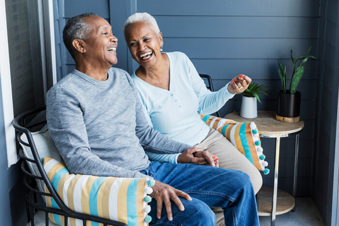 independent living couple relaxing on patio