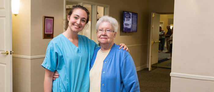 Independence village caregiver with senior woman