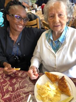 a senior resident with a caregiver