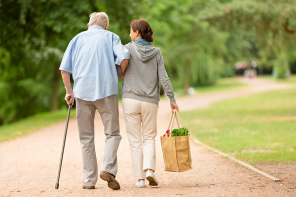 caregiver walking with senior