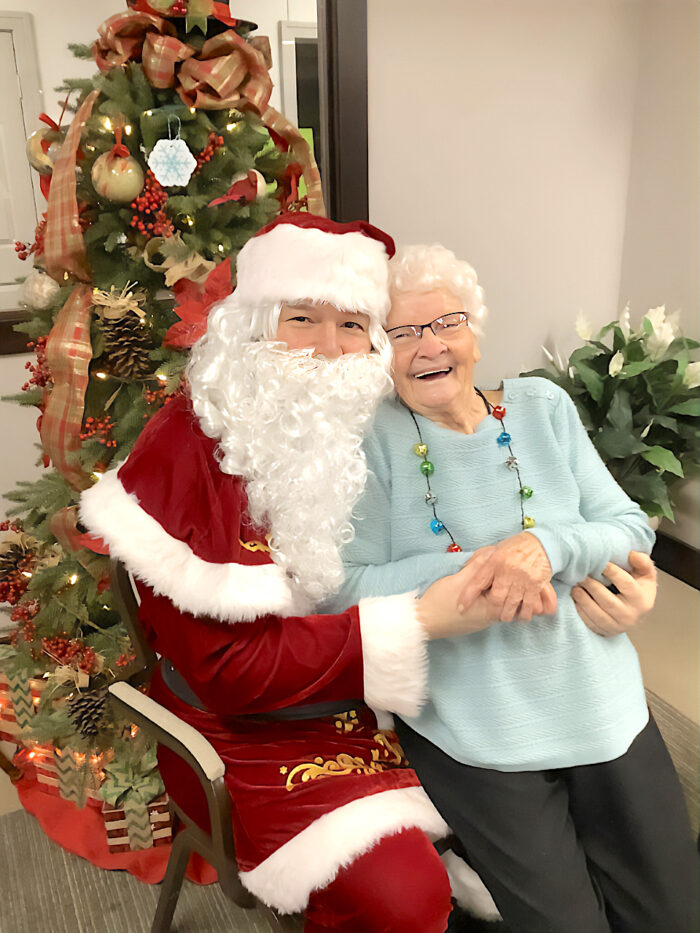 elderly woman with santa