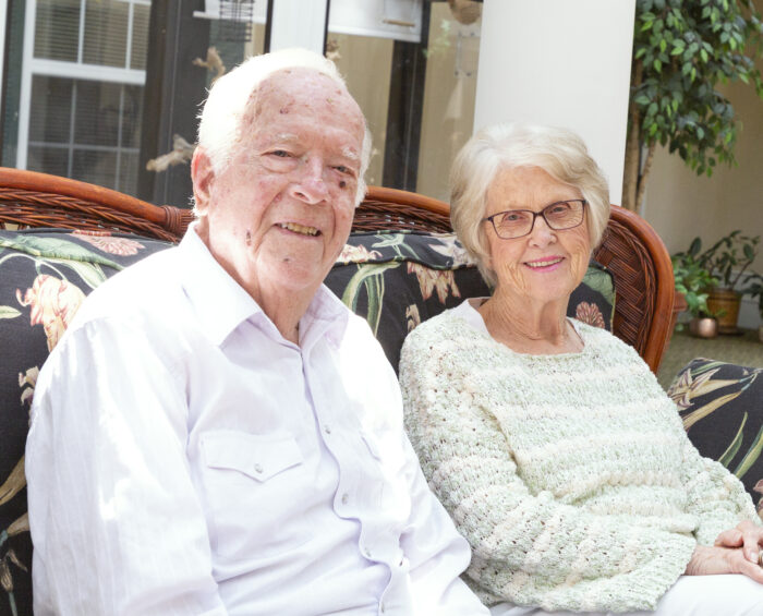 Senior couple sitting together on patio