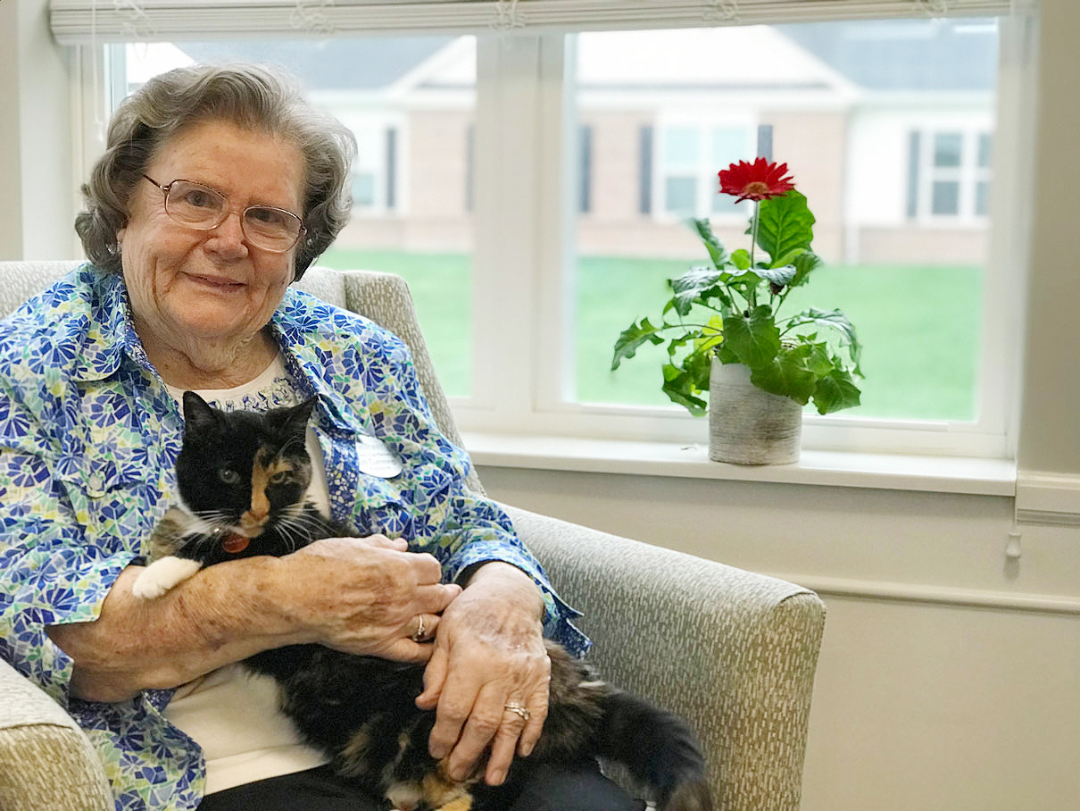 StoryPoint resident with her cat named Muffin