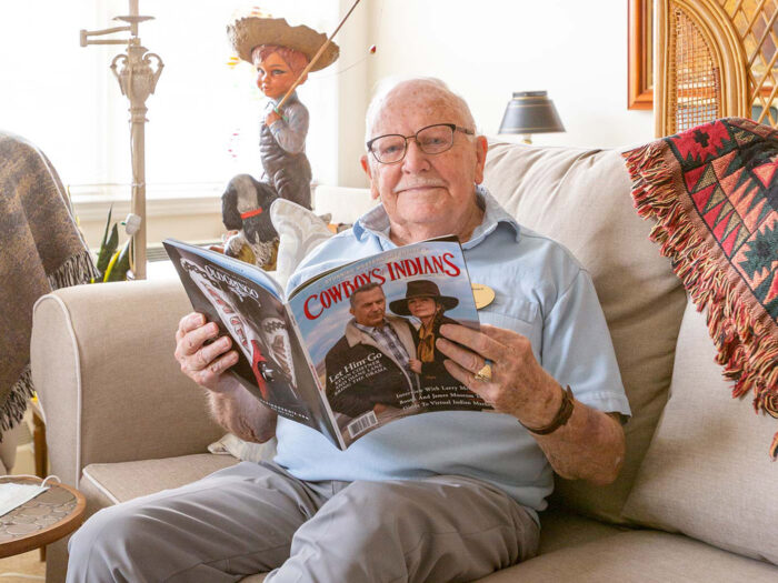 Senior man with magazine