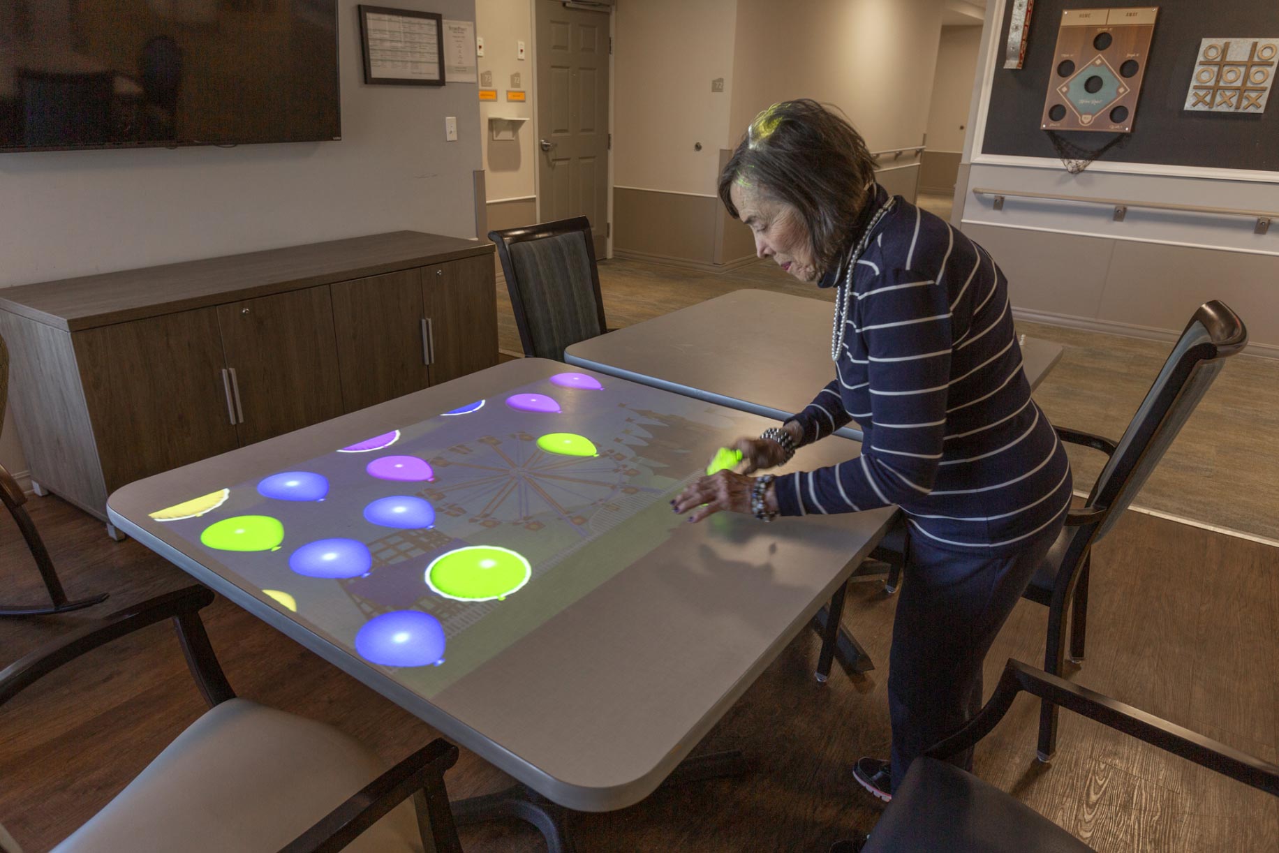 senior woman doing a memory care activity