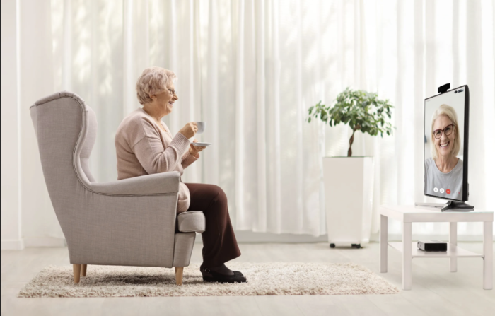 Senior woman in front of TV