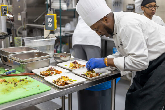 StoryPoint Chef plating food at the 2023 Dorsey Culinary Competition