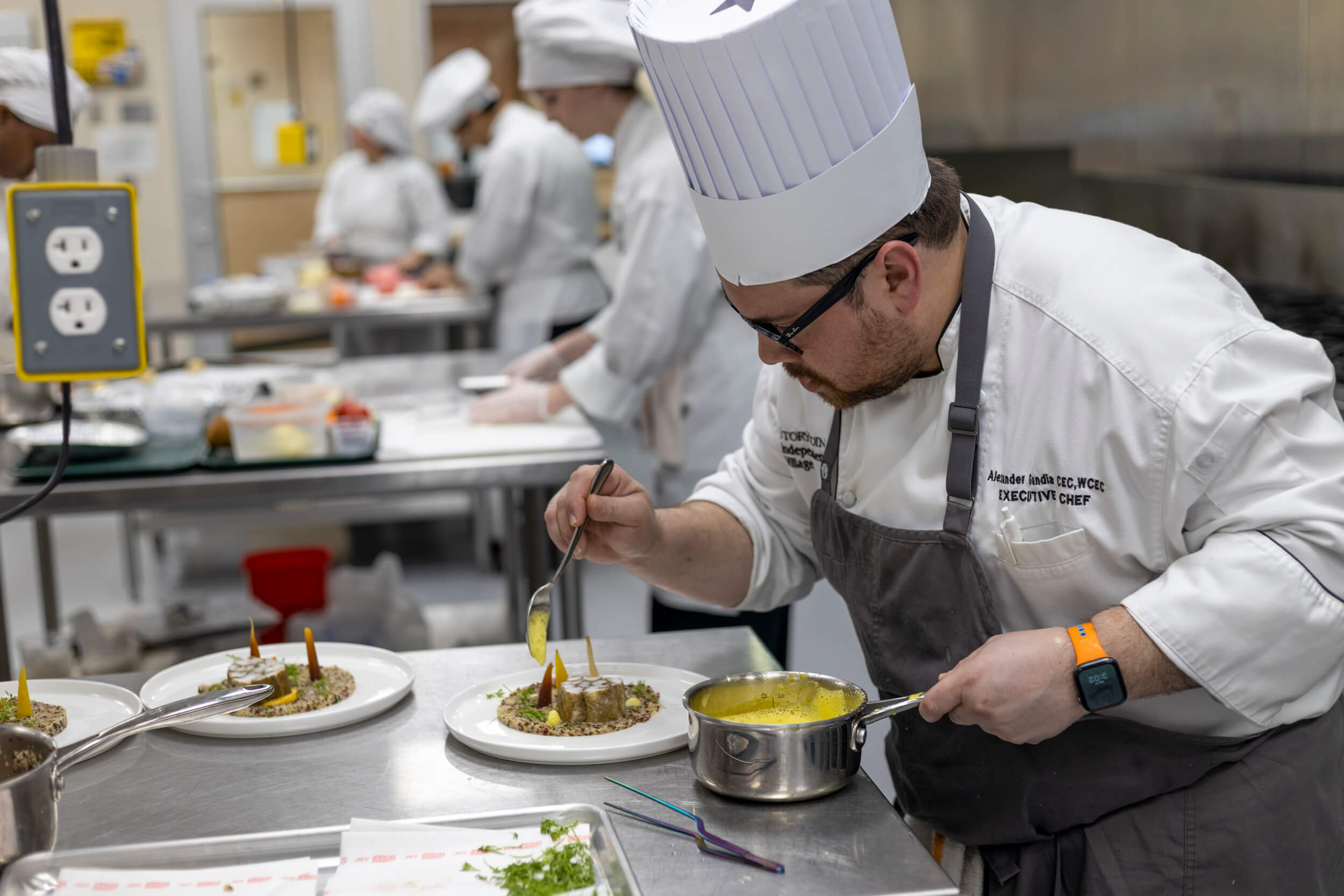 StoryPoint executive Chef plating food at the 2023 Dorsey Culinary Competition