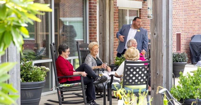 A group of senior women eating outside