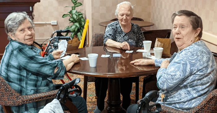 senior living residents playing cards