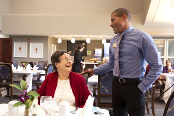 StoryPoint employee talking to assisted living resident