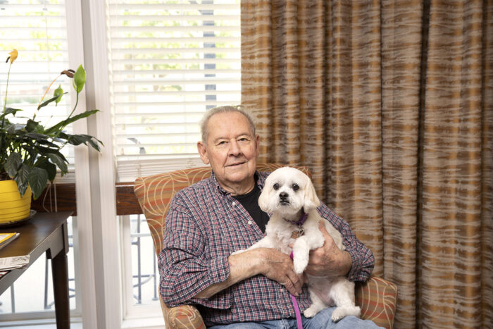 StoryPoint resident holding his dog