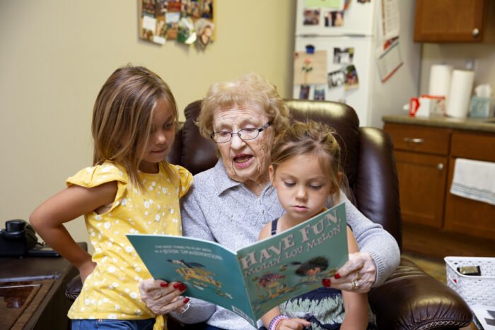 StoryPoint resident reading to grandchildren