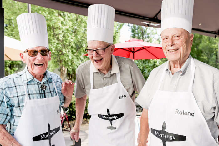 Seniors grilling outside