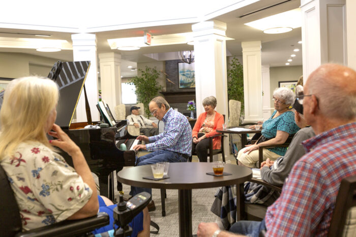 StoryPoint residents listening to live piano