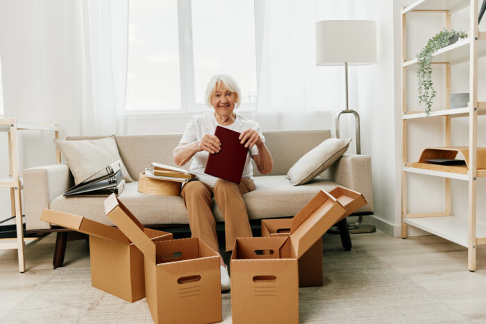 senior packing things into boxes