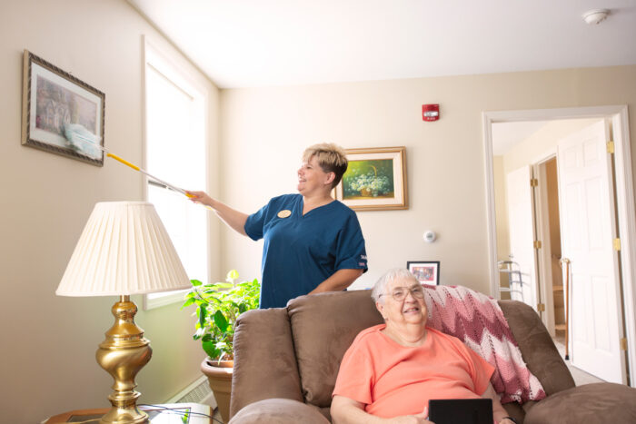 senior woman and StoryPoint caregiver inside house