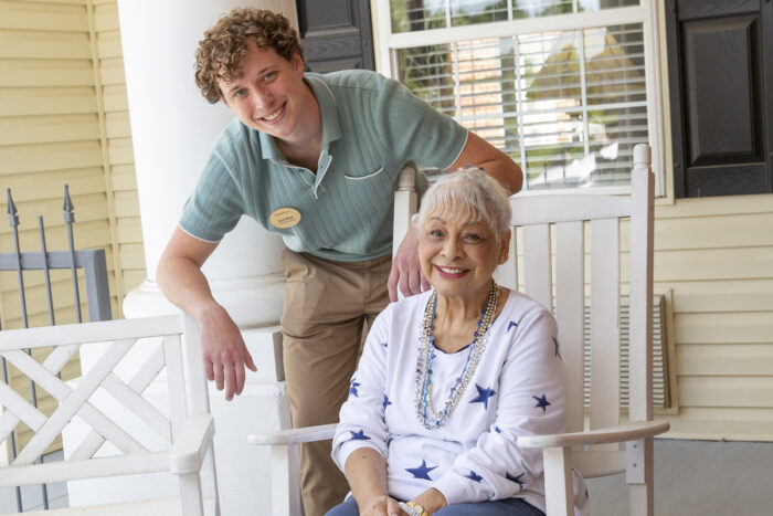 resident and caregiver smiling