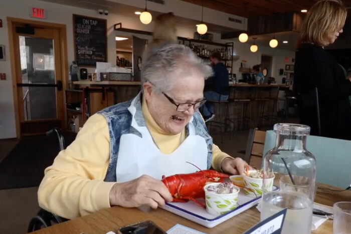 audrey smiling eating lobster
