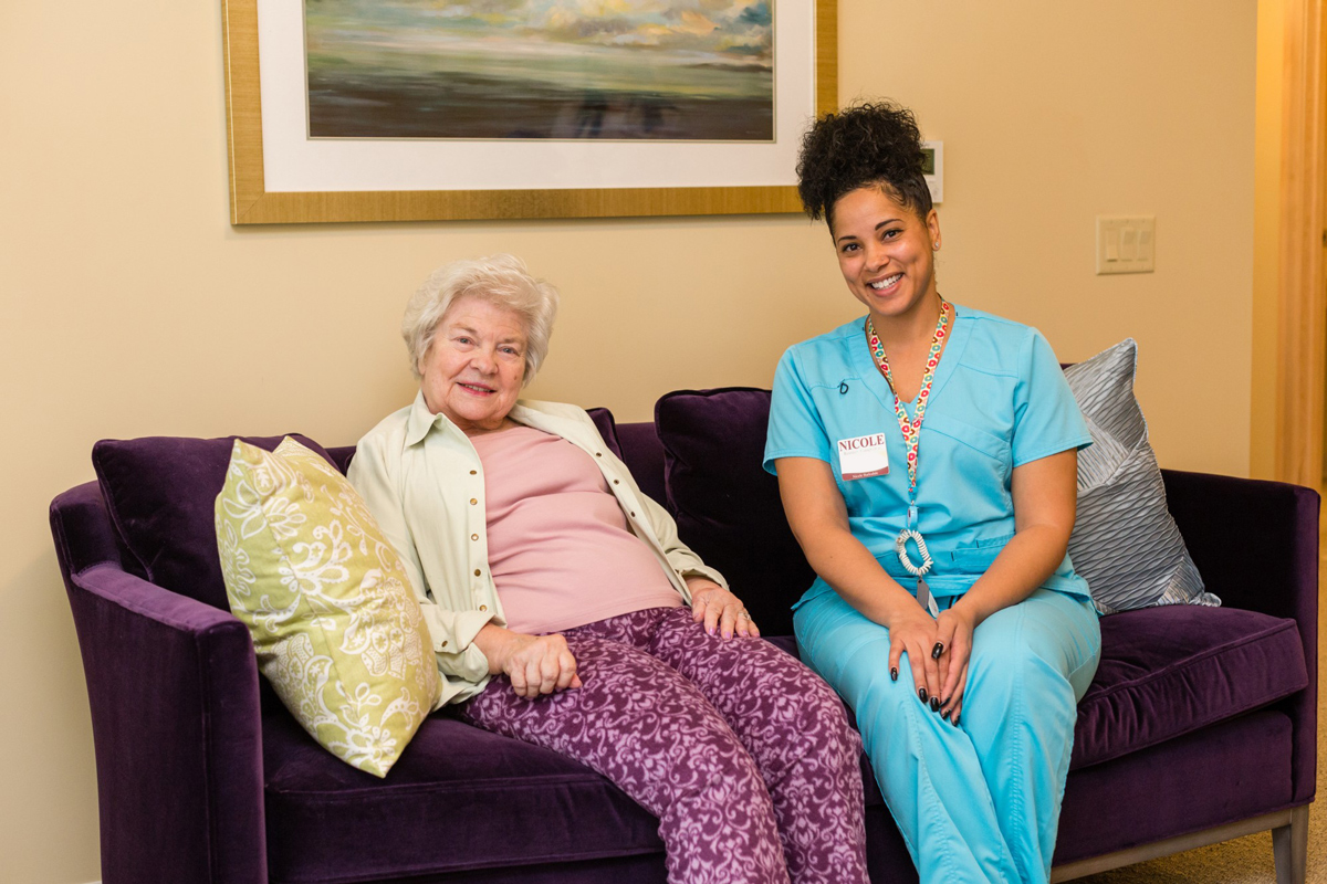 StoryPoint caregiver and resident smiling