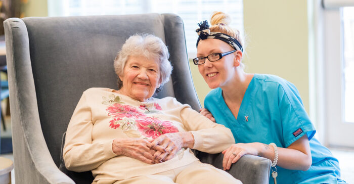 StoryPoint resident and caregiver smiling