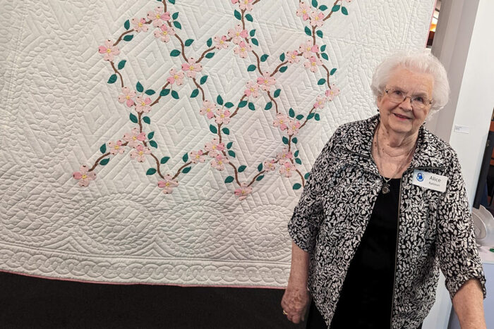 storypoint resident with quilt