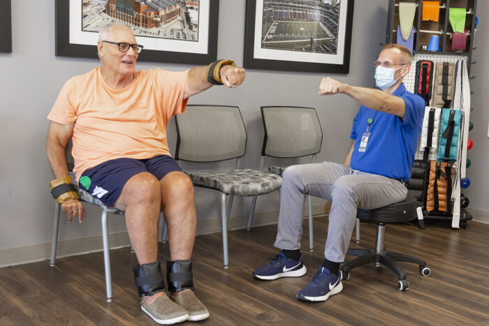 StoryPoint Residents performing chair exercises