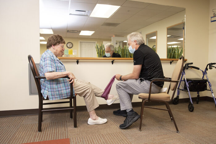 StoryPoint residents performing chair exercise