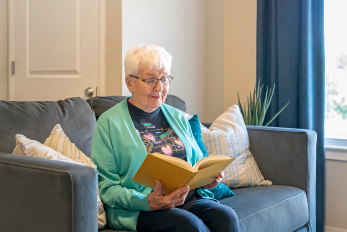 storypoint resident reading a book