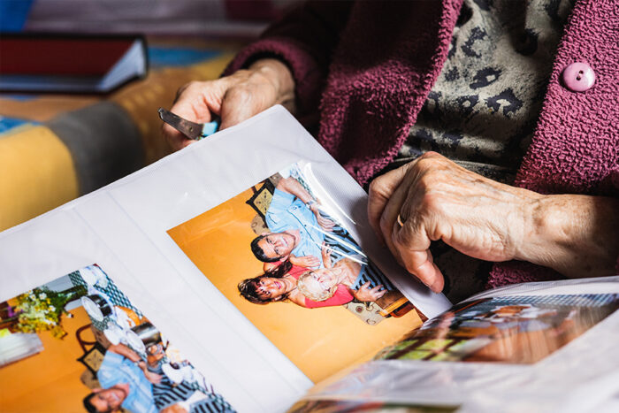 senior looking at scrapbook