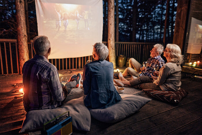 seniors watching a movie outdoors 