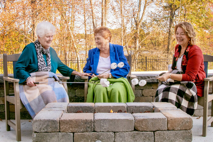 seniors around a campfire