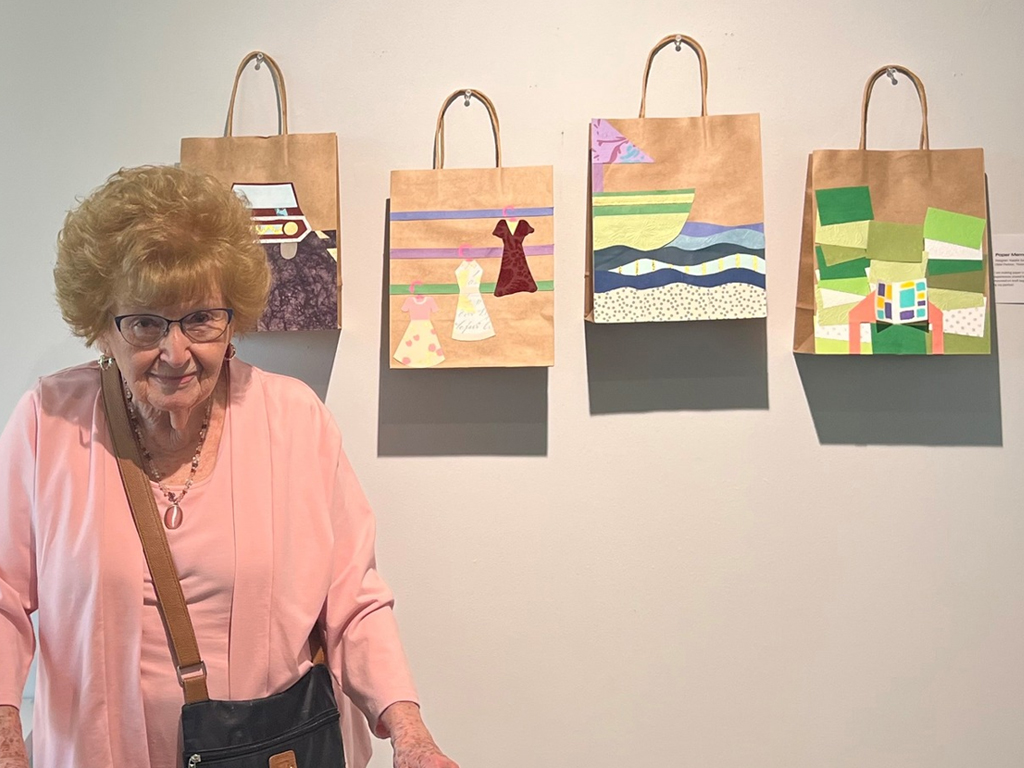 StoryPoint Group resident with painted bags