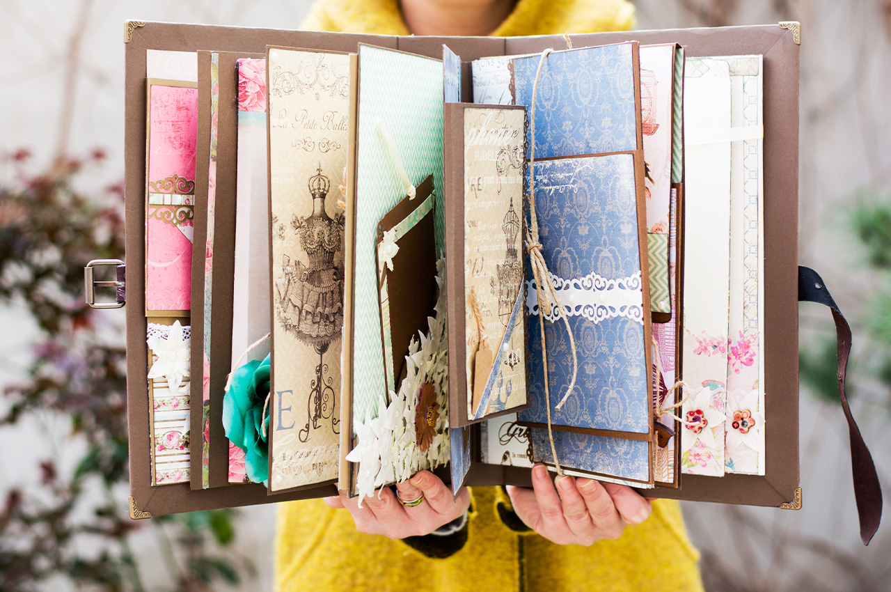 person holding a scrapbook