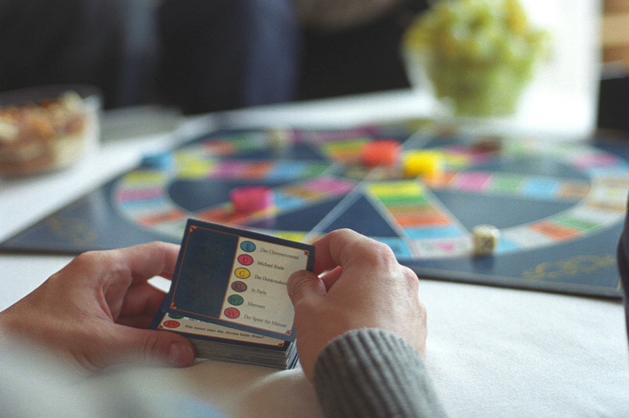 person holding a card for a board game